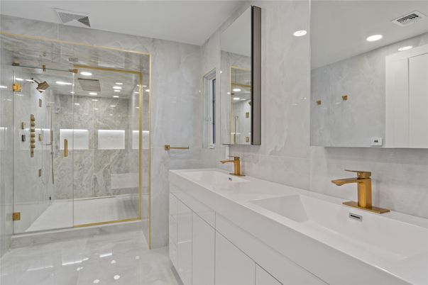 Bathroom, Dual Sink Vanities, Glass Shower, Interior, Marble, Marble Walls, Recessed Lighting