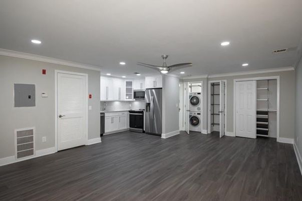 Empty room, Interior, Kitchen, Recessed Lighting, Stainless Steel Appliances, Wood Texture Flooring