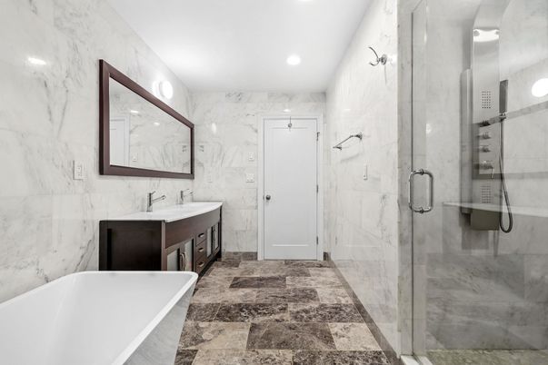 Bathroom, Dual Sink Vanities, Free Standing Baths, Glass Shower, Interior, Marble Walls, Recessed Lighting
