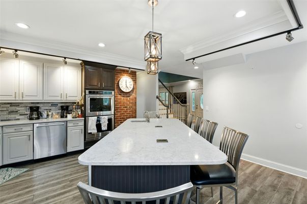 Dining room, Interior, Kitchen, Pendant Lights, Recessed Lighting, Stainless Steel Appliances, Wood Texture Flooring