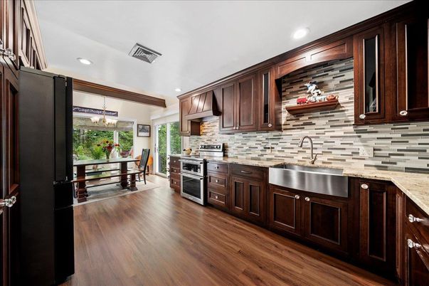 Chandelier, Dining room, Interior, Kitchen, Recessed Lighting, Stainless Steel Appliances, Wood Texture Flooring