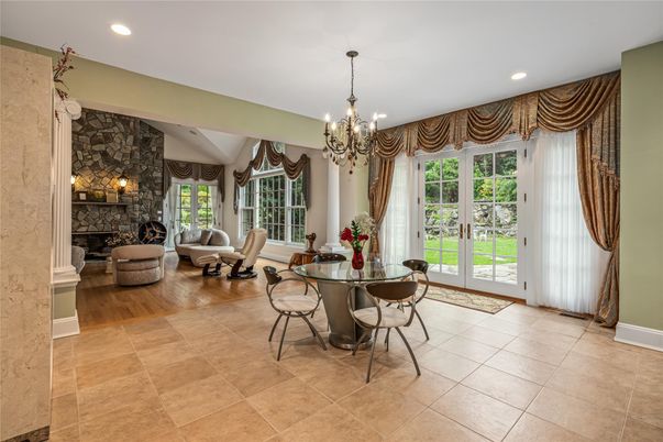 Chandelier, Dining room, Fireplace, Interior, Living room, Recessed Lighting, Stone Walls, Wood Texture Flooring