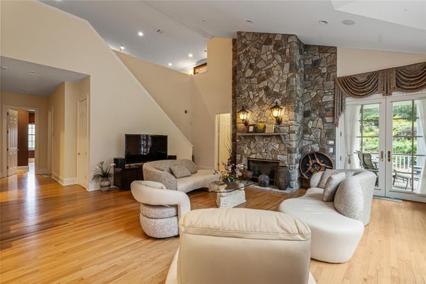 Fireplace, Interior, Living room, Recessed Lighting, Stone Walls, Wood Texture Flooring