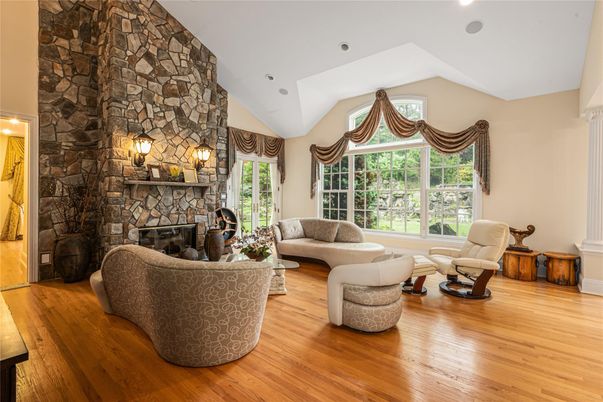 Fireplace, Interior, Living room, Recessed Lighting, Stone Walls, Wood Texture Flooring