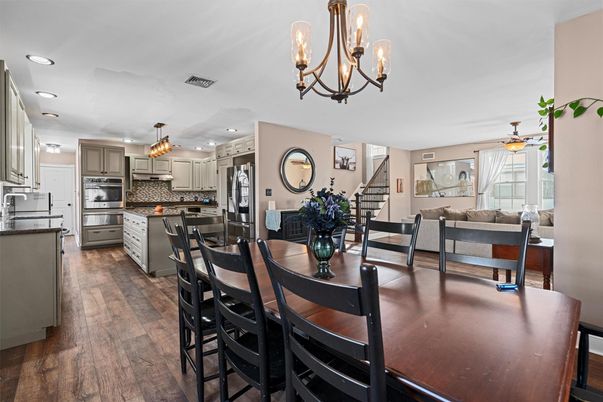 Chandelier, Dining room, Interior, Kitchen, Living room, Recessed Lighting, Stainless Steel Appliances, Wood Texture Flooring