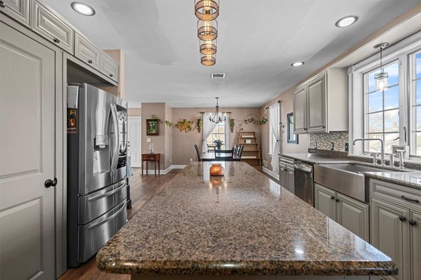 Chandelier, Dining room, Interior, Kitchen, Pendant Lights, Recessed Lighting, Stainless Steel Appliances, Wood Texture Flooring