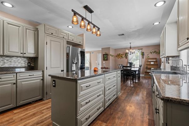 Chandelier, Dining room, Interior, Kitchen, Recessed Lighting, Stainless Steel Appliances, Wood Texture Flooring