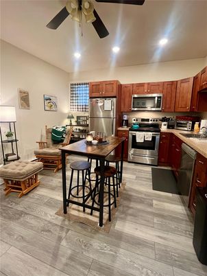 Dining room, Interior, Kitchen, Recessed Lighting, Stainless Steel Appliances, Wood Texture Flooring