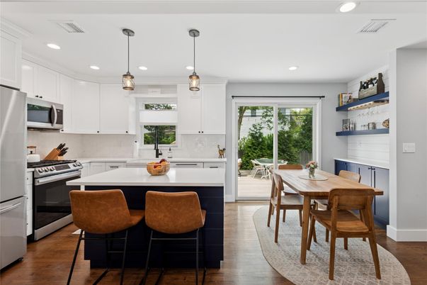 Dining room, Interior, Kitchen, Pendant Lights, Recessed Lighting, Stainless Steel Appliances, Wood Texture Flooring