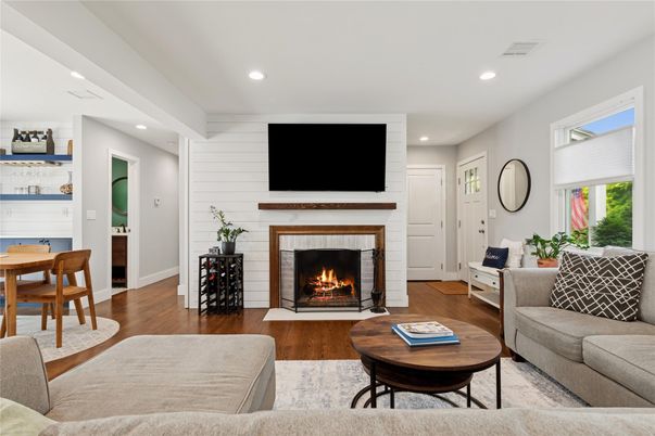 Dining room, Fireplace, Interior, Living room, Recessed Lighting, Wood Texture Flooring