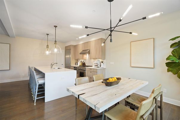 Dining room, Interior, Kitchen, Pendant Lights, Recessed Lighting, Stainless Steel Appliances, Wood Texture Flooring
