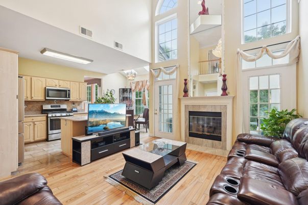 Chandelier, Fireplace, Interior, Kitchen, Living room, Stainless Steel Appliances, Wood Texture Flooring