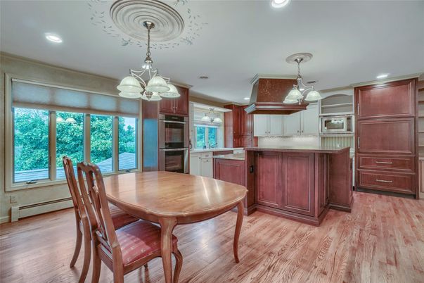 Chandelier, Dining room, Interior, Kitchen, Recessed Lighting, Stainless Steel Appliances, Wood Texture Flooring