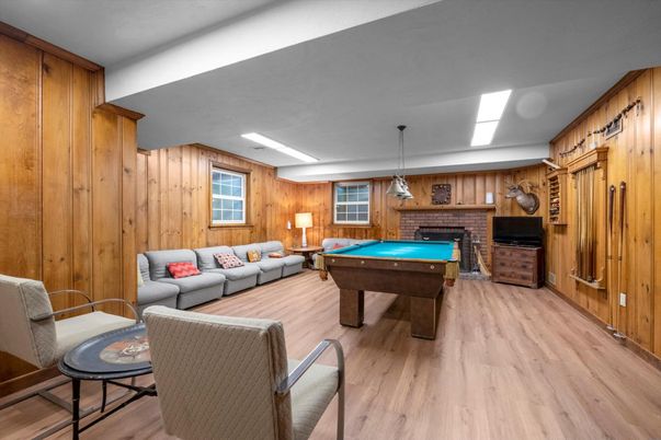 Billiard Table, Fireplace, Game Room, Interior, Living room, Pendant Lights, Wood Texture Flooring, Wooden Walls