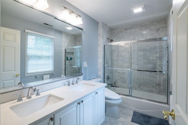 Bathroom, Dual Sink Vanities, Glass Shower, Interior, Marble, Marble Walls, Recessed Lighting