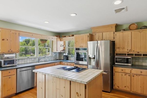 Interior, Kitchen, Recessed Lighting, Stainless Steel Appliances, Tile Countertops, Wood Texture Flooring