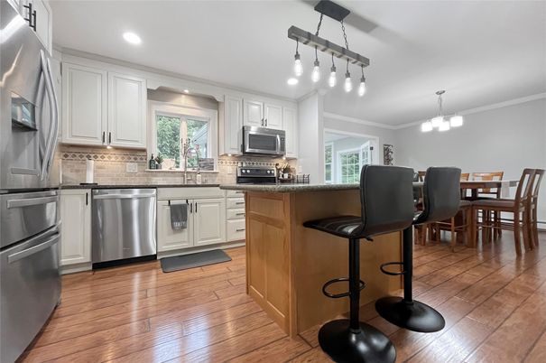 Dining room, Interior, Kitchen, Pendant Lights, Recessed Lighting, Stainless Steel Appliances, Wood Texture Flooring