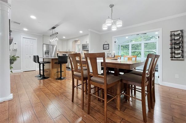 Chandelier, Dining room, Interior, Kitchen, Pendant Lights, Recessed Lighting, Stainless Steel Appliances, Wood Texture Flooring