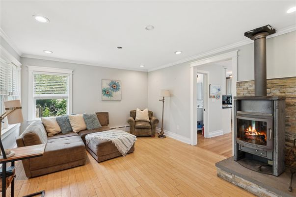 Fireplace, Interior, Living room, Recessed Lighting, Stone Walls, Wood Texture Flooring