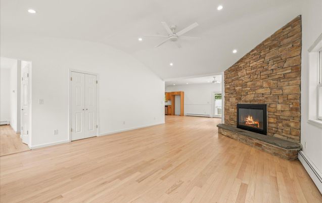 Empty room, Fireplace, Interior, Recessed Lighting, Stone Walls, Wood Texture Flooring