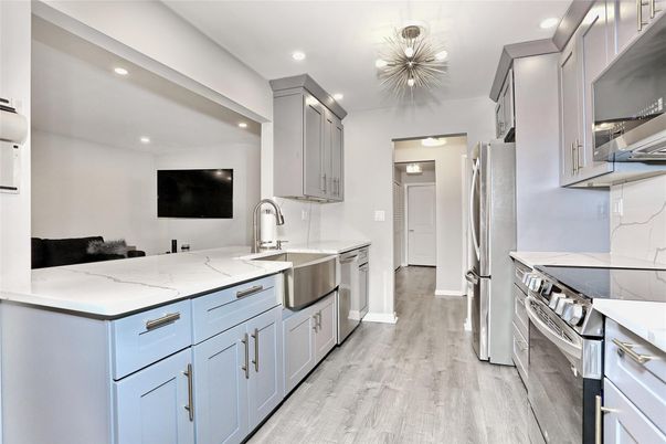 Interior, Kitchen, Recessed Lighting, Stainless Steel Appliances, Wood Texture Flooring