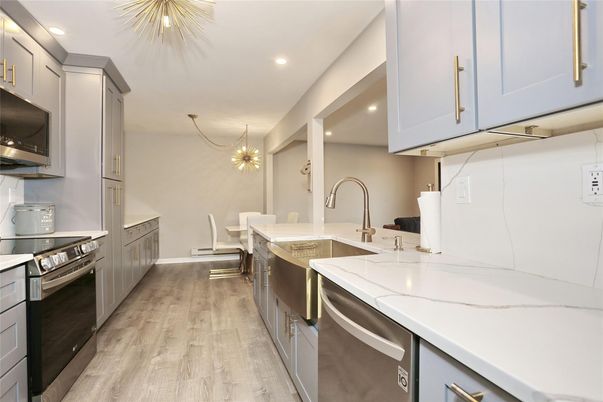 Chandelier, Dining room, Interior, Kitchen, Pendant Lights, Recessed Lighting, Stainless Steel Appliances, Wood Texture Flooring