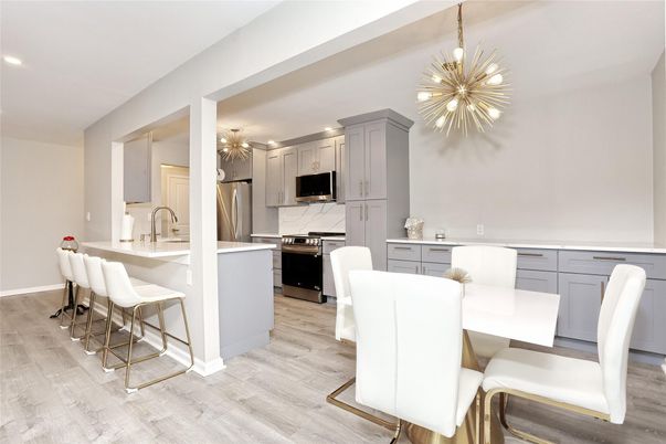 Dining room, Interior, Kitchen, Pendant Lights, Recessed Lighting, Stainless Steel Appliances, Wood Texture Flooring