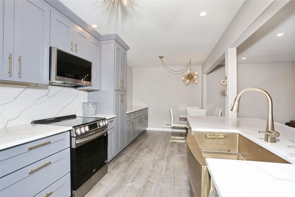 Chandelier, Dining room, Interior, Kitchen, Recessed Lighting, Stainless Steel Appliances, Wood Texture Flooring