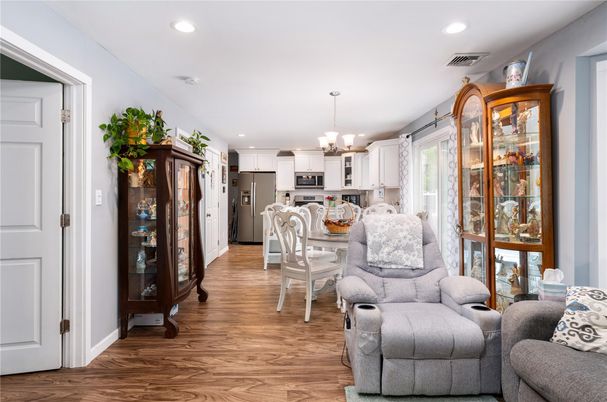 Chandelier, Dining room, Interior, Kitchen, Recessed Lighting, Stainless Steel Appliances, Wood Texture Flooring