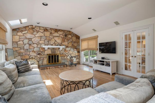 Fireplace, Interior, Living room, Recessed Lighting, Stone Walls, Wood Texture Flooring