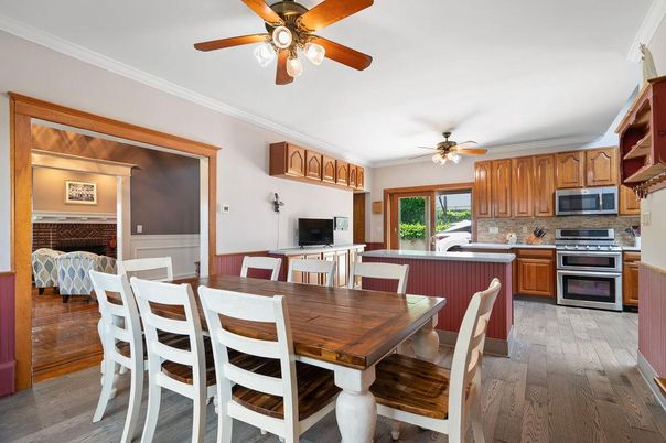 Dining room, Fireplace, Interior, Kitchen, Stainless Steel Appliances, Wood Texture Flooring