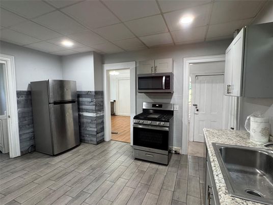 Interior, Kitchen, Recessed Lighting, Stainless Steel Appliances, Wood Texture Flooring