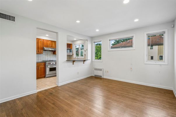 Empty room, Interior, Kitchen, Recessed Lighting, Tile Countertops, Wood Texture Flooring