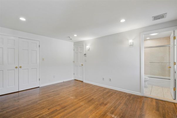 Bathroom, Empty room, Glass Shower, Interior, Recessed Lighting, Wood Texture Flooring