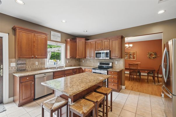 Chandelier, Dining room, Interior, Kitchen, Recessed Lighting, Stainless Steel Appliances, Wood Texture Flooring
