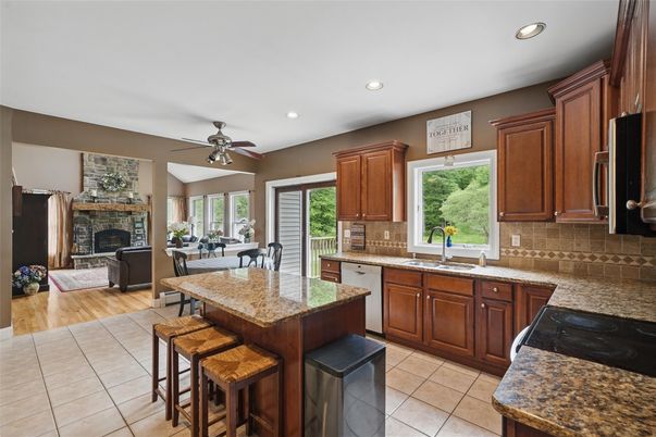 Dining room, Fireplace, Interior, Kitchen, Living room, Recessed Lighting, Wood Texture Flooring