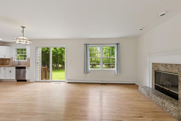 Empty room, Fireplace, Interior, Kitchen, Pendant Lights, Wood Texture Flooring