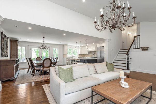 Chandelier, Dining room, Interior, Kitchen, Living room, Pendant Lights, Recessed Lighting, Stainless Steel Appliances, Wood Texture Flooring