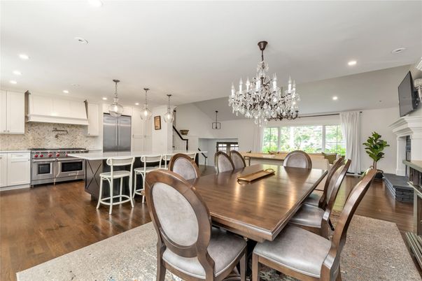 Chandelier, Dining room, Fireplace, Interior, Kitchen, Pendant Lights, Recessed Lighting, Stainless Steel Appliances, Wood Texture Flooring