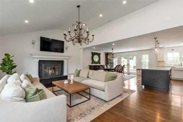 Chandelier, Dining room, Fireplace, Interior, Living room, Pendant Lights, Recessed Lighting, Wood Texture Flooring