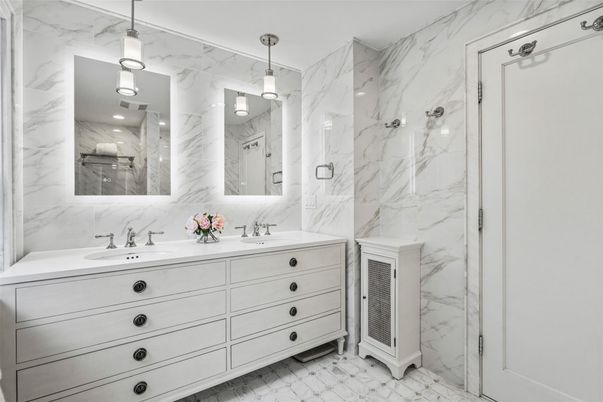 Bathroom, Dual Sink Vanities, Glass Shower, Interior, Marble, Marble Walls, Pendant Lights, Recessed Lighting