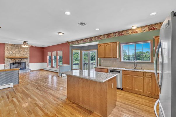 Fireplace, Interior, Kitchen, Recessed Lighting, Stone Walls, Wood Texture Flooring