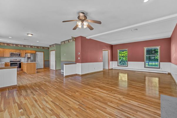 Empty room, Interior, Kitchen, Recessed Lighting, Stainless Steel Appliances, Wood Texture Flooring