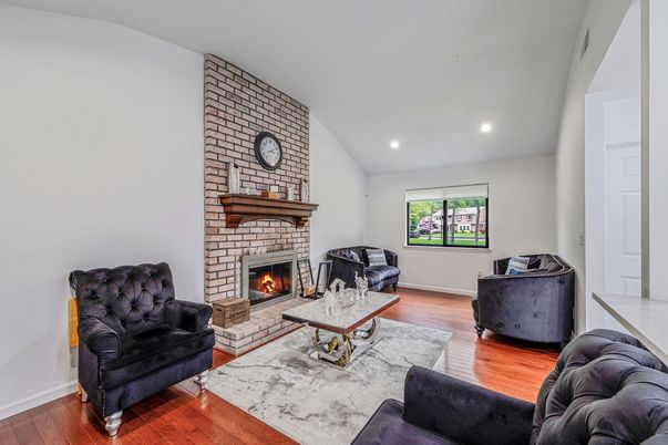 Fireplace, Interior, Living room, Recessed Lighting, Stone Walls, Wood Texture Flooring