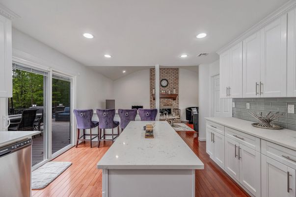 Dining room, Fireplace, Interior, Kitchen, Recessed Lighting, Stone Walls, Wood Texture Flooring