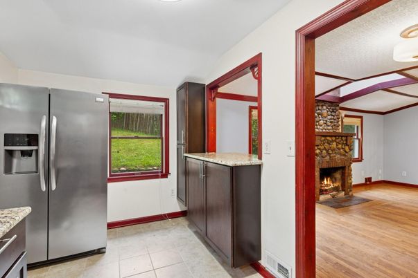 Fireplace, Interior, Kitchen, Stainless Steel Appliances, Wood Texture Flooring
