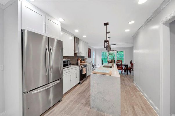 Dining room, Interior, Kitchen, Pendant Lights, Recessed Lighting, Stainless Steel Appliances, Wood Texture Flooring