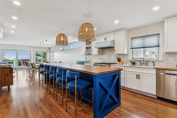 Dining room, Interior, Kitchen, Pendant Lights, Recessed Lighting, Stainless Steel Appliances, Wood Texture Flooring