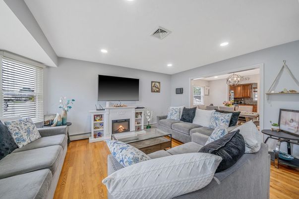 Chandelier, Dining room, Fireplace, Interior, Kitchen, Living room, Recessed Lighting, Wood Texture Flooring