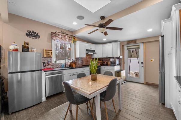 Dining room, Interior, Kitchen, Recessed Lighting, Stainless Steel Appliances, Wood Texture Flooring